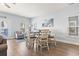 Inviting dining area with wood floors and comfortable seating; bright and airy at 1514-A S Ocean Blvd., Surfside Beach, SC 29575
