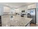 Spacious kitchen featuring granite countertops, modern stainless steel appliances, and ample cabinet space at 1514-A S Ocean Blvd., Surfside Beach, SC 29575