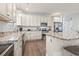 Well-equipped kitchen features granite countertops, stainless steel appliances and plentiful storage at 1514-A S Ocean Blvd., Surfside Beach, SC 29575