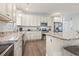 Modern kitchen with granite countertops and white cabinets at 1514-A S Ocean Blvd., Surfside Beach, SC 29575