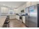 Kitchen with granite countertops, white cabinets, and island with seating at 1514-A S Ocean Blvd., Surfside Beach, SC 29575