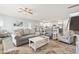 Open-concept living room with modern furnishings flowing to dining area and kitchen, great for entertaining at 1514-A S Ocean Blvd., Surfside Beach, SC 29575