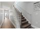 Staircase with brown carpet runner and white railing at 1514-A S Ocean Blvd., Surfside Beach, SC 29575