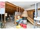 Unfinished basement with exposed framing and storage items at 155 Busbee St., Conway, SC 29526