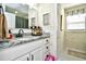 Bright bathroom with white cabinets and hexagon tile floor at 155 Busbee St., Conway, SC 29526