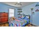 Blue bedroom with a comfy bed, ample storage, and a ceiling fan at 155 Busbee St., Conway, SC 29526