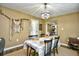 Bright dining room with a table and chairs, offering views into the living room at 155 Busbee St., Conway, SC 29526