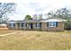 Brick ranch house with a landscaped yard and walkway at 155 Busbee St., Conway, SC 29526