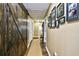 Long hallway with a rustic barn door and hardwood floors at 155 Busbee St., Conway, SC 29526