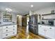 Modern kitchen features granite countertops, white cabinets, and stainless steel appliances at 155 Busbee St., Conway, SC 29526