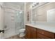 Modern bathroom with a large shower, single vanity, and wood cabinets at 1625 Crosswinds Ave., North Myrtle Beach, SC 29582