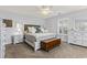 Bright bedroom featuring a king-size bed and ample storage at 1671 Arundel Rd., Myrtle Beach, SC 29577