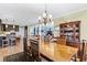 Bright dining room with hardwood floors and elegant chandelier at 1671 Arundel Rd., Myrtle Beach, SC 29577