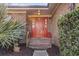 Brick home with inviting red front door and landscaping at 1671 Arundel Rd., Myrtle Beach, SC 29577