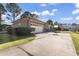 Brick garage with attached carport and spacious driveway at 1671 Arundel Rd., Myrtle Beach, SC 29577