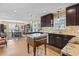 Open concept kitchen with island and view into dining area at 1671 Arundel Rd., Myrtle Beach, SC 29577