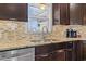 Kitchen details showing granite countertop and stainless steel sink and dishwasher at 1671 Arundel Rd., Myrtle Beach, SC 29577