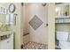 Updated shower with tiled walls and built-in seat at 1671 Arundel Rd., Myrtle Beach, SC 29577