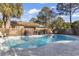 Inviting kidney-shaped pool with brick wall and surrounding patio at 1671 Arundel Rd., Myrtle Beach, SC 29577