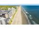 Aerial view of beachfront high-rise building and beach at 1690 North Waccamaw Dr. # 807, Garden City Beach, SC 29576