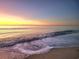 Ocean waves rolling onto sandy beach at sunrise at 1690 North Waccamaw Dr. # 807, Garden City Beach, SC 29576