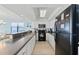 Modern kitchen with white cabinets and black appliances at 1690 North Waccamaw Dr. # 807, Garden City Beach, SC 29576