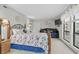 Primary bedroom with a king-size bed and daybed at 1801 N Ocean Blvd. # F-1, North Myrtle Beach, SC 29582