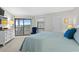 Spacious bedroom with king-size bed and access to balcony at 1801 N Ocean Blvd. # F-1, North Myrtle Beach, SC 29582