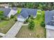Beautiful aerial view of the house with a long driveway and well-manicured front yard at 184 Retreat Pl., Little River, SC 29566
