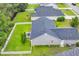 Aerial view of backyard featuring green lawn, privacy fence, and patio at 184 Retreat Pl., Little River, SC 29566
