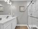 Bathroom with a glass enclosed shower with decorative tile and updated fixtures at 184 Retreat Pl., Little River, SC 29566