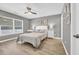 Bedroom with a window, wood floors, and neutral wall colors at 184 Retreat Pl., Little River, SC 29566