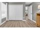 Bedroom featuring natural light, a spacious closet, and wood floors at 184 Retreat Pl., Little River, SC 29566