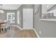 Dining area with wood floors, dining table, chandelier and a large window allowing natural light at 184 Retreat Pl., Little River, SC 29566