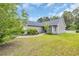 Landscaped lawn frames this lovely home, showcasing its well-maintained exterior and inviting curb appeal at 184 Retreat Pl., Little River, SC 29566