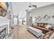 Open-concept living area with fireplace, wood floors, and modern decor at 184 Retreat Pl., Little River, SC 29566