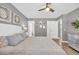 Spacious bedroom with wood floors, gray walls, and ensuite bathroom at 184 Retreat Pl., Little River, SC 29566