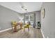 Bright home office featuring a wooden desk and yellow chairs at 184 Retreat Pl., Little River, SC 29566