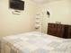 Bedroom with mounted TV and wood dresser at 187 Stephen Dr., Hemingway, SC 29554