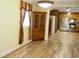 Dining room with hardwood floors and view into the kitchen at 187 Stephen Dr., Hemingway, SC 29554