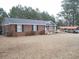 Brick ranch house with attached carport and yard at 187 Stephen Dr., Hemingway, SC 29554