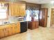 Kitchen with wood cabinets, granite countertops, and pantry at 187 Stephen Dr., Hemingway, SC 29554