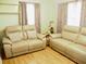 Living area with two beige recliners and wood flooring at 187 Stephen Dr., Hemingway, SC 29554