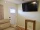 Living room with beige recliner, console table, and large TV at 187 Stephen Dr., Hemingway, SC 29554