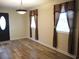 Living room with hardwood floors and large windows at 187 Stephen Dr., Hemingway, SC 29554