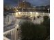 Night view of a lighted waterfront deck with seating at 1919 Spring St. # B11, North Myrtle Beach, SC 29582