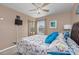 Bedroom with a bed, ceiling fan, and mirrored closet doors at 1943 Bent Grass Dr. # H, Myrtle Beach, SC 29575