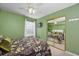 Bedroom with mirrored closet and ceiling fan at 1943 Bent Grass Dr. # H, Myrtle Beach, SC 29575