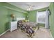 Green-walled bedroom with a bed and ceiling fan at 1943 Bent Grass Dr. # H, Myrtle Beach, SC 29575