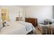 Bright bedroom featuring a wooden dresser and a cozy armchair creating an inviting and comfortable space at 195 Talladega Dr. # 430, Myrtle Beach, SC 29579